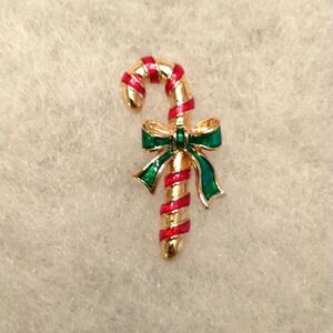Vintage Avon Christmas pin, gold tone candy cane. 1.25 inch.